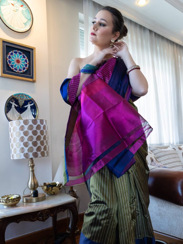 beautifully weaved stripes in purple pink, moss green stripes with blue silk border Saree
