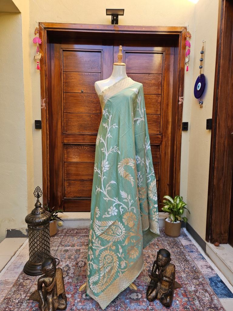 Sea green katan silk dupatta with silver thread pattern,parrots motifs, cutwork
